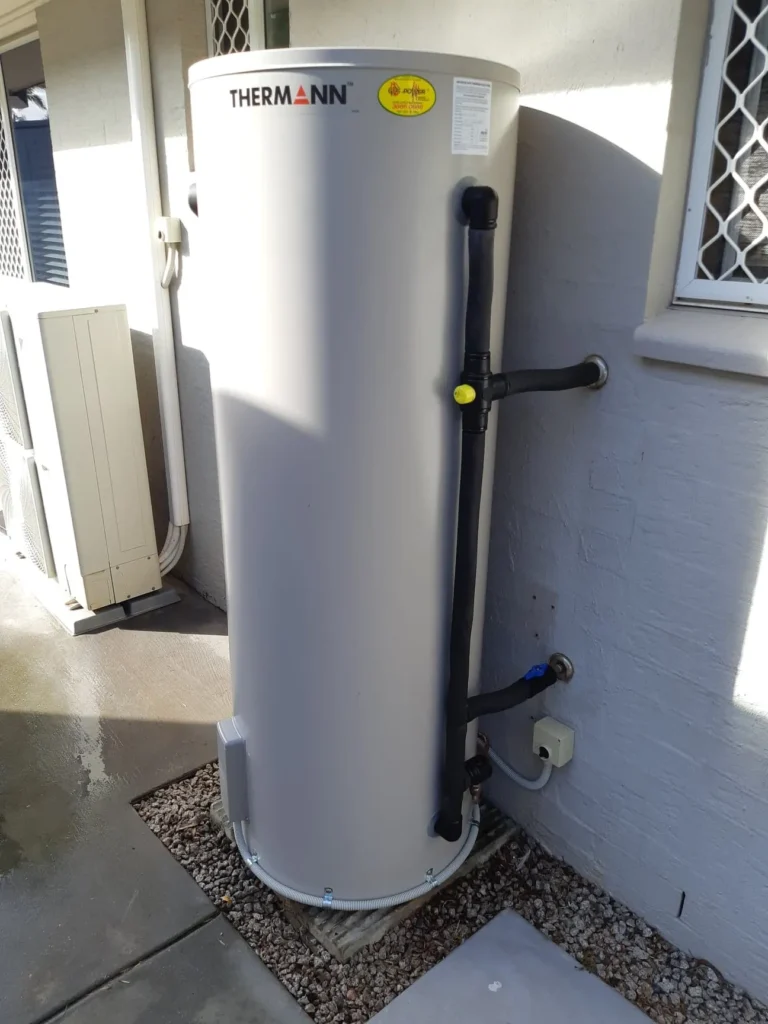 Thermann electric hot water tank installed outside a house
