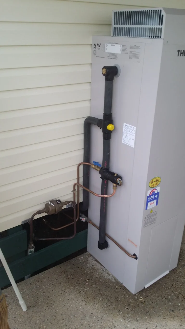 Gas storage hot water system installed outdoors
